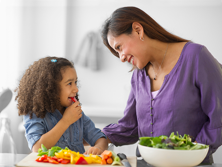 Mother and daughter enjoying a salad