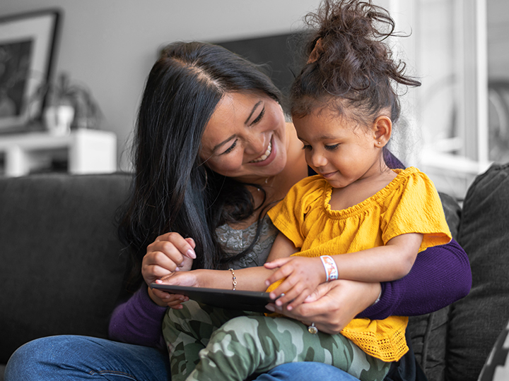 Mother and daughter using tablet