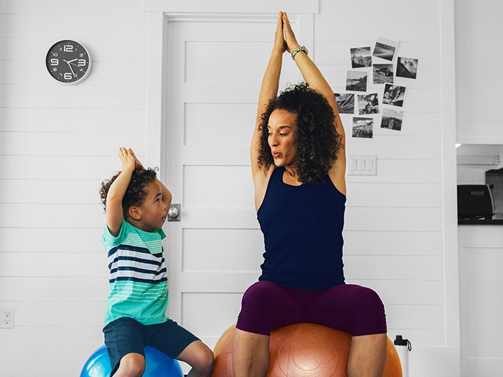 Mother and son exercising using medicine ball Mother and son exercising using medicine ball