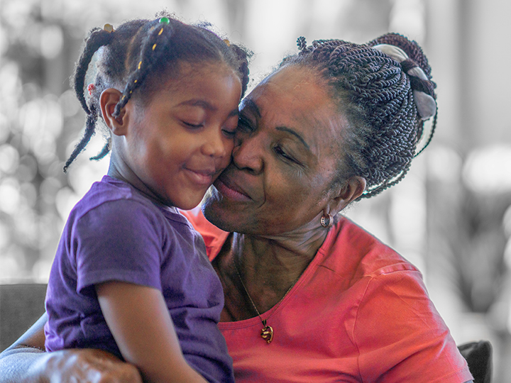 Grandmother hugging granddaughter