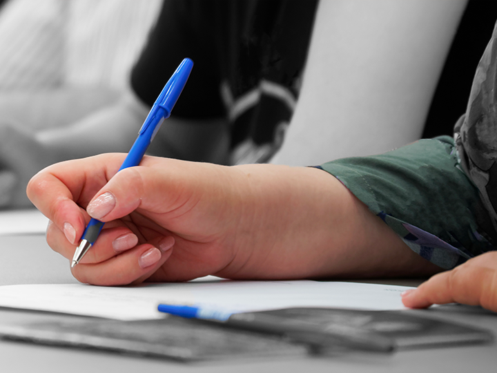 person writing something down