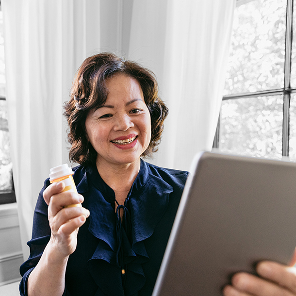 woman holding pill bottle