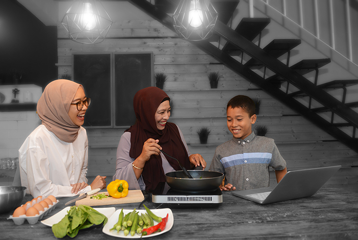 Family watching healthy cooking classes online